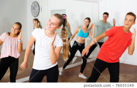 Teen girl training dance in choreography class Teen girl training dance in choreography class 76035149