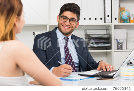 Colleagues meeting in office Colleagues meeting in office 76035345