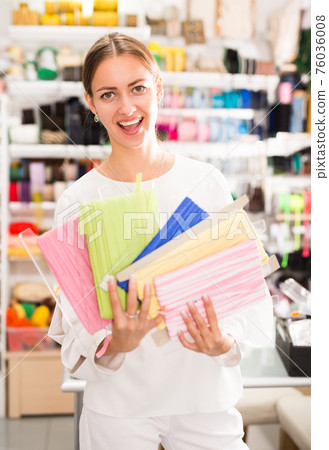 Excited girl showing ribbons Excited girl showing ribbons 76036008