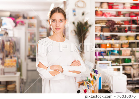 Successful female owner of sewing supplies store Successful female owner of sewing supplies store 76036070