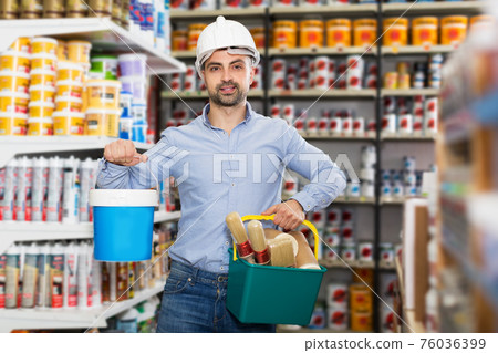 Male in helmet in paint store Male in helmet in paint store 76036399