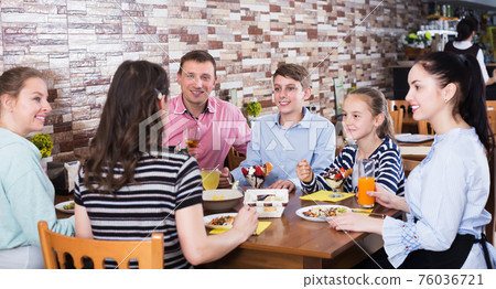 Big family in cafe 76036721