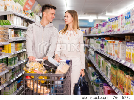 couple with purchases in cart couple with purchases in cart 76036722