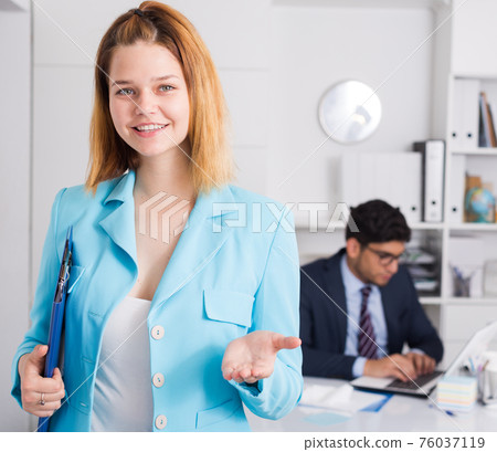 Businesswoman welcoming to company office 76037119