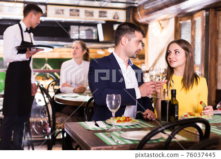 Couple is celebrating of day dating for dinner Couple is celebrating of day dating for dinner 76037445