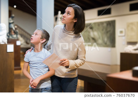 Woman and boy visiting museum Woman and boy visiting museum 76037670