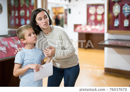 Woman and boy visiting museum Woman and boy visiting museum 76037678