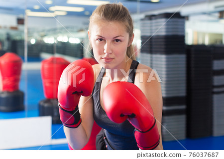 Woman boxing in gym Woman boxing in gym 76037687