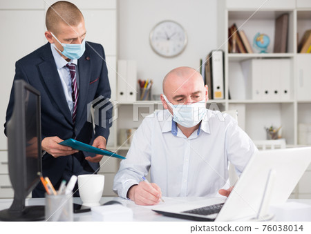 Businessman in the office makes a joint project with business partner, discussing the nuances Businessman in the office makes a joint project with business partner, discussing the nuances 76038014