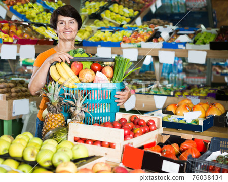 Happy woman is demonstraiting basket Happy woman is demonstraiting basket 76038434