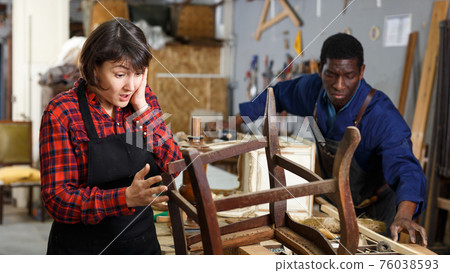 Outraged woman restorer at workshop 76038593
