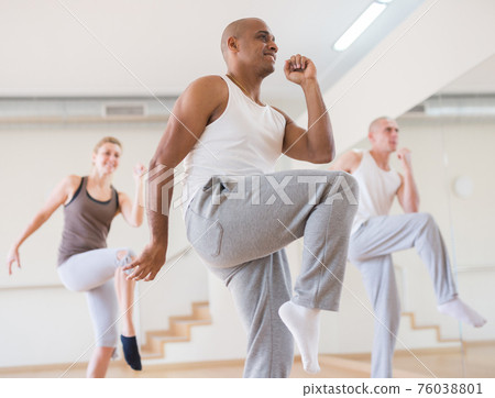 Group of activity people practicing dance techniques Group of activity people practicing dance techniques 76038801