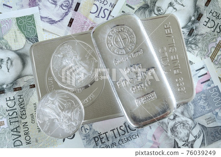 Investment silver brick and coins on czech currency 76039249