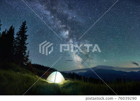 View of night mountain landscape with Milky Way galaxy. 76039290