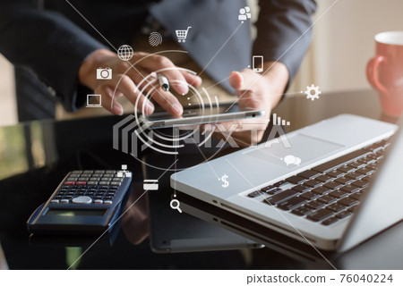 Send a message to a colleague, a businessman, confident in matching a tablet and sitting in office. Send a message to a colleague, a businessman, confident in matching a tablet and sitting in office. 76040224