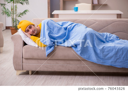 Young man suffering at home Young man suffering at home 76043826