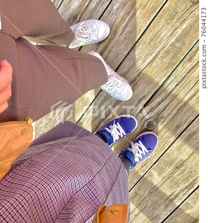 Couple's cute feet Couple's cute feet 76044173