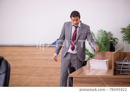 Young businessman employee in bullying concept in the office Young businessman employee in bullying concept in the office 76045922