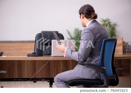Young businessman employee in bullying concept in the office Young businessman employee in bullying concept in the office 76045925