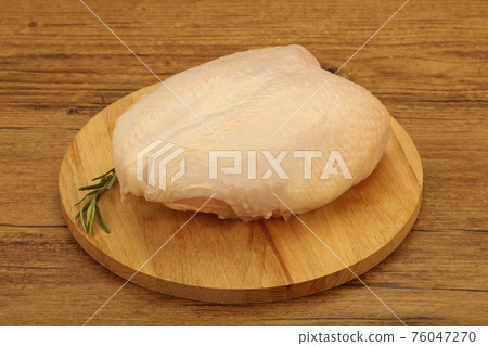 Raw whole chicken breast with skin 76047270