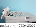 photocopier is a machine that makes paper copies of documents and other visual images ,close-up multi-function device, printer scanner, copier. 76048309