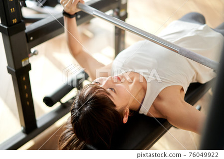 Asian Chinese Female Barbell Workout Exercise At Gym Stock Photo