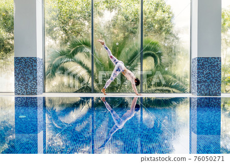 beautiful sporty woman yoga asana practice morning routine 76050271