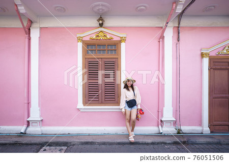 Travelers on street Phuket old town with Building Sino Portuguese architecture at Phuket Old Town area Phuket, Thailand. Travel concept Travelers on street Phuket old town with Building Sino Portuguese architecture at Phuket Old Town area Phuket, Thailand. Travel concept 76051506