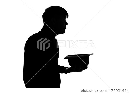 Sad poor young man holding hat and asking for money over blue background Sad poor young man holding hat and asking for money over blue background 76051664