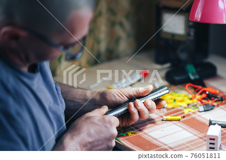 man hands repair make broken tv remote 76051811