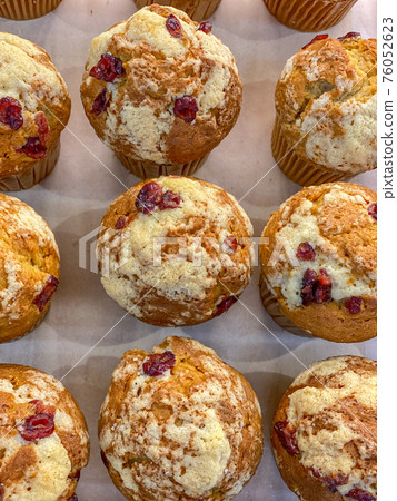Full frame photo of raspberry muffins on a tray Full frame photo of raspberry muffins on a tray 76052623