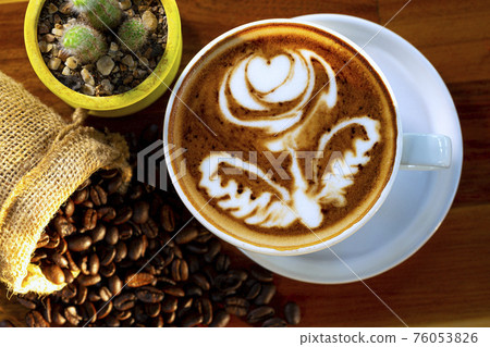 cup of hot coffee on a dark background cup of hot coffee on a dark background 76053826