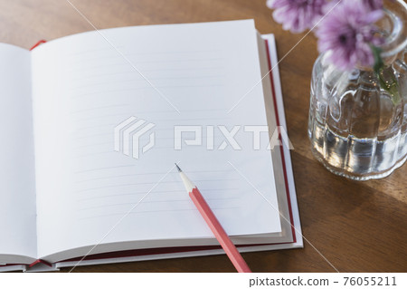 White page of notebook and pencil 76055211