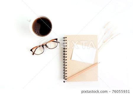 Notebook with of dry grass, glasses and coffee on white background. flat lay, top view, copy space. Notebook with of dry grass, glasses and coffee on white background. flat lay, top view, copy space. 76055931