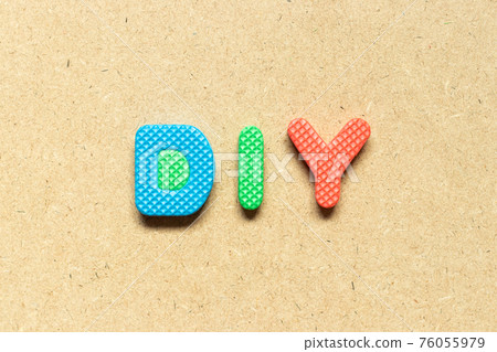 Foam alphabet letter in word DIY (abbreviation of do it yourself) on wood background Foam alphabet letter in word DIY (abbreviation of do it yourself) on wood background 76055979