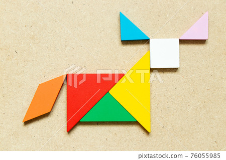 Color tangram puzzle in ox, buffalo or bull shape on wood background 76055985
