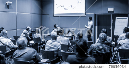 Business speaker giving talk at business conference event. 76056084