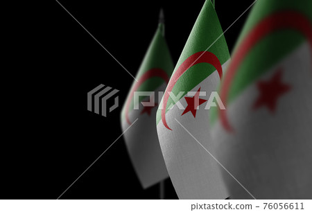 Small national flags of the Algeria on a black background Small national flags of the Algeria on a black background 76056611