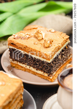 Piece of homemade poppy seed cake on a plate 76057609