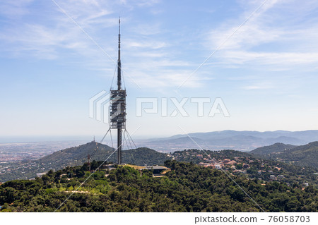 View of Collserola Tower (Torre de Collserola) on Tibidabo mountain in Barcelona View of Collserola Tower (Torre de Collserola) on Tibidabo mountain in Barcelona 76058703