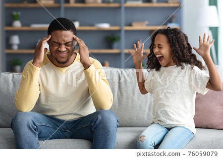 Stubborn noisy african child girl and annoyed tired black father Stubborn noisy african child girl and annoyed tired black father 76059079