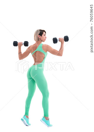 Strong woman with dumbbells. Photo of sporty woman in sportswear on white background. Back view Strong woman with dumbbells. Photo of sporty woman in sportswear on white background. Back view 76059645