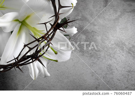 Good Friday, Passion of Jesus Christ. Crown of thorns, nails and white lily on grey background. Christian Easter holiday. Good Friday, Passion of Jesus Christ. Crown of thorns, nails and white lily on grey background. Christian Easter holiday. 76060487