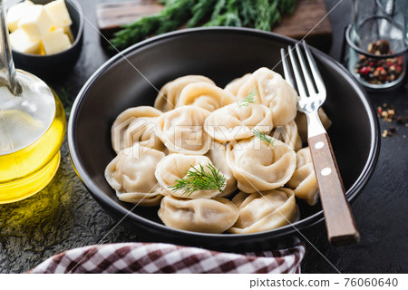 Russian Pelmeni, stuffed boiled dumplings 76060640