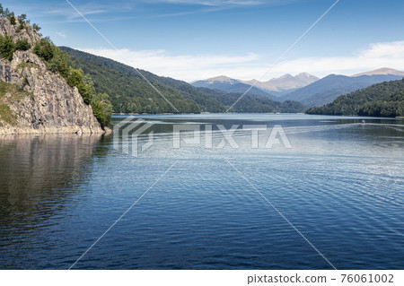 Cruising ship on the storage lake Vidraru, Arges county, Romania 76061002