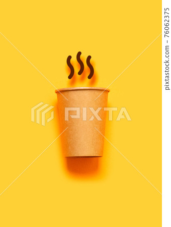 Coffee time. Paper cup with aromatic coffee on yellow background Coffee time. Paper cup with aromatic coffee on yellow background 76062375