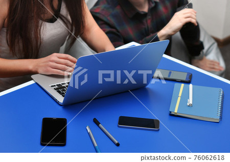 Programmer, Mobile Application Designers, Web Designer working at office. Teamwork and programming websites and mobile applications on the laptop. Programmer, Mobile Application Designers, Web Designer working at office. Teamwork and programming websites and mobile applications on the laptop. 76062618