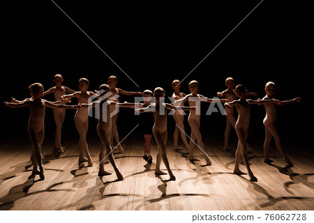 A large group of children rehearsing and dancing the ballet. A large group of children rehearsing and dancing the ballet. 76062728