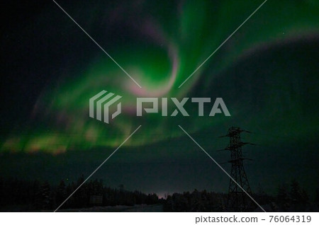 northern light on the silent field before sun rise. 76064319