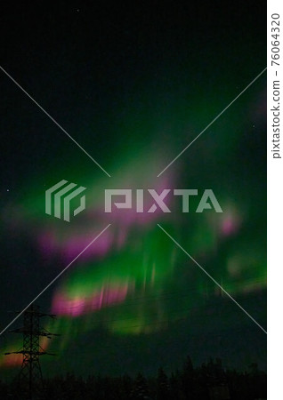 northern light on the silent field before sun rise. 76064320